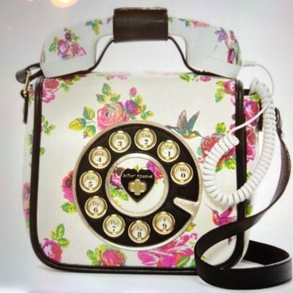 White floral telephone crossbody bag.  Textured leather feel with hot pink roses
